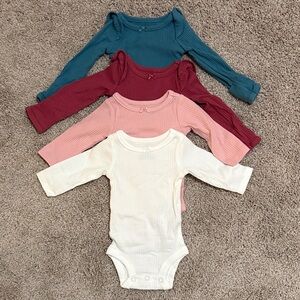 Carter’s Newborn Ribbed Bodysuits 4-Pack